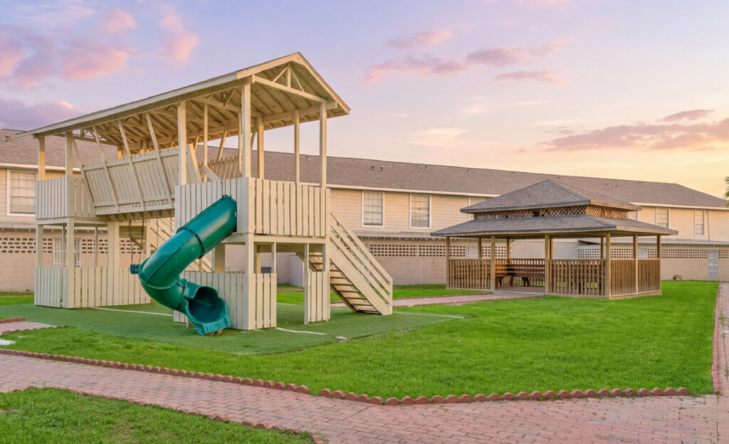 Children playground and gazebo at Falls of Braeburn apartment community Houston TX